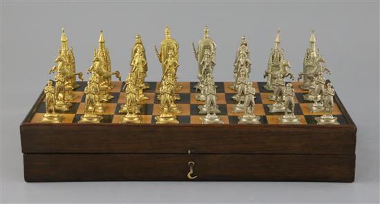 A figural silvered and gilded metal chess set in fitted rosewood and boxwood folding box/chess board, c.1860, Board size : 31cm x 31 cm
